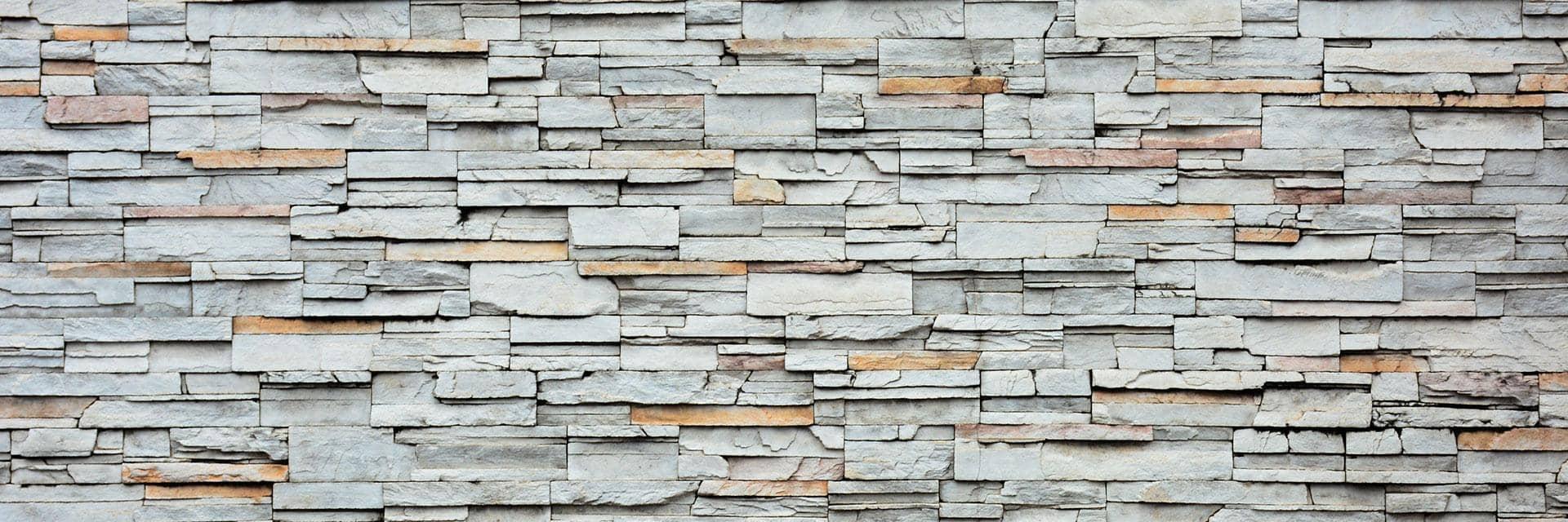 A wall made of natural stone. More businesses in construction are using the BREAAM standard.
