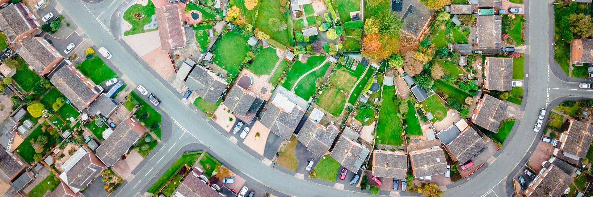 An ariel view of a neighbourhood. We offer support to local governments as they analyse challenges.
